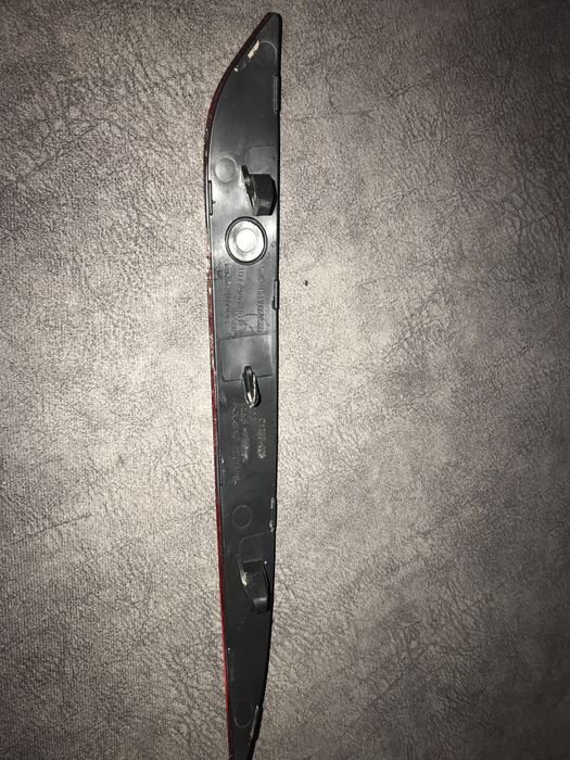 Отражатель заднего бампера левый Tesla mod 3