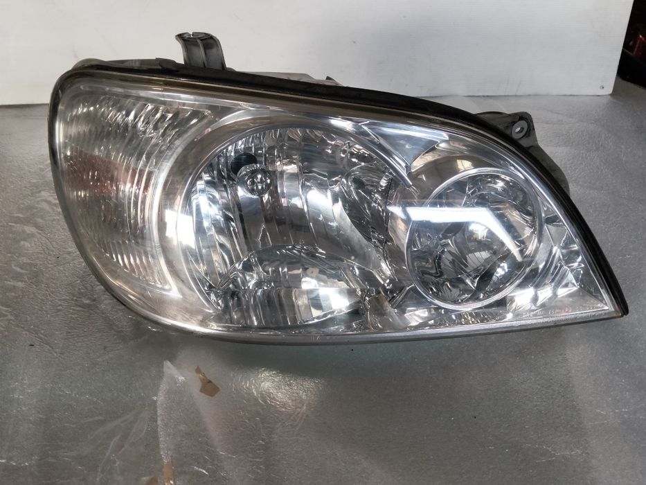 Farol Kia carnival 2 ótica original 2003  facelift