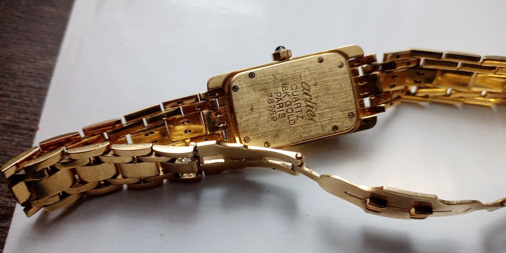 Złoty zegarek, cartier z brylantami, pr.750