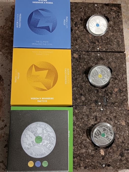 3 moedas prata prof de 5€ . O  Clima