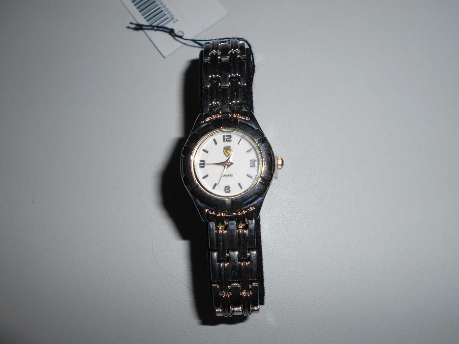 Dois relógios marca Ferrari senhora e homem