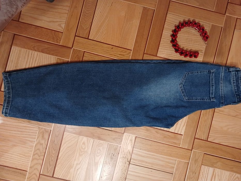 Джинси труби синього кольору