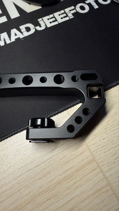 Pega superior (top handle) para câmara
