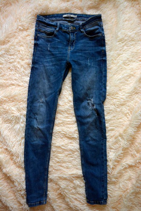 Spodnie jeansowe z dziurami Sinsay