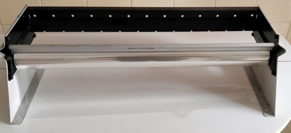 Dispensador de papel de embrulho.