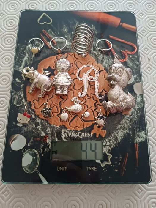 105 gramas de artigos em prata