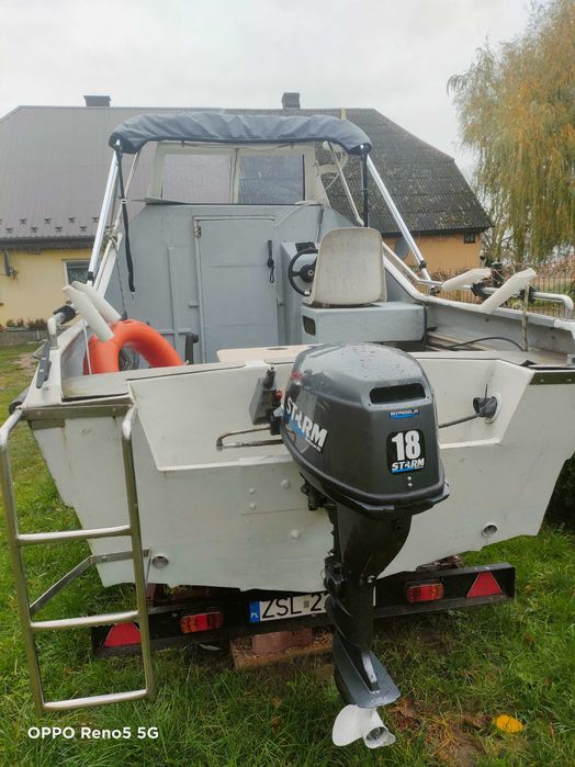 Łódź kabinowa z silnikiem i przyczepą