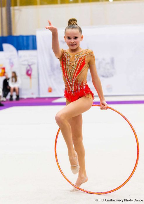 Strój startowy do gimnastyki artystycznej 134-146 cm stan bdb, Leotard