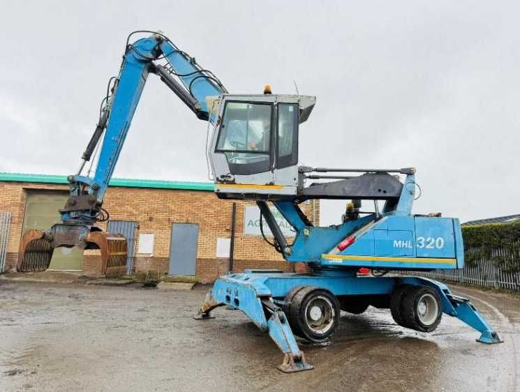 Екскаватор для перевалки лісу , металолома FUCHS MHL 320