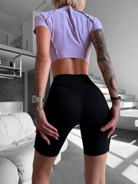 Трендові жіночі спортивні лосини зі швами та підкресленням фігури