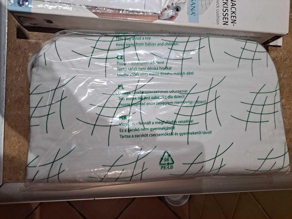 Wygrzewająca poduszka elektryczna na plecy i kark.