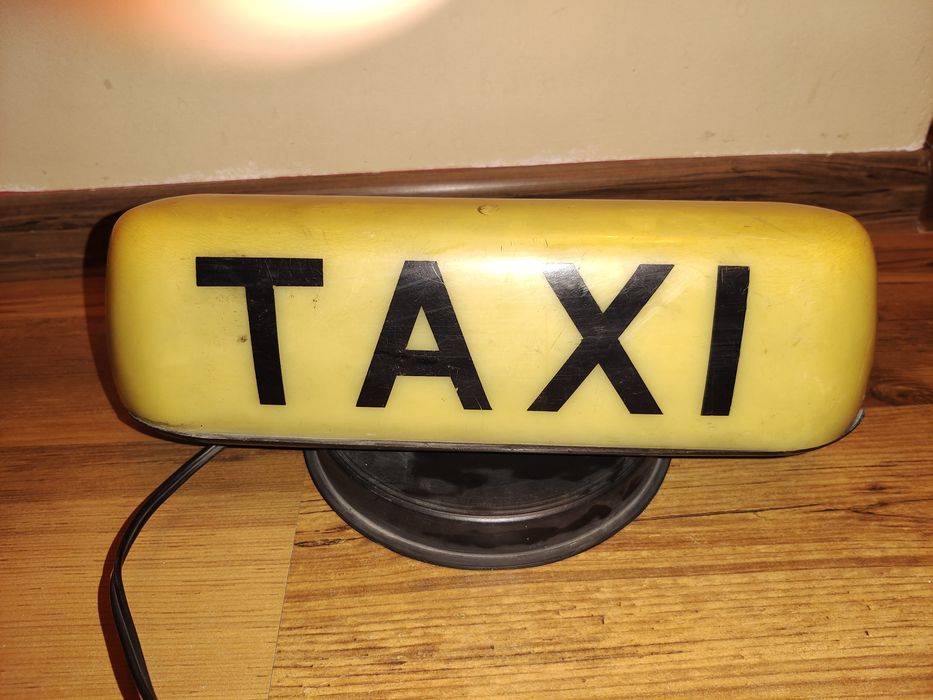 Kogut szyld TAXI