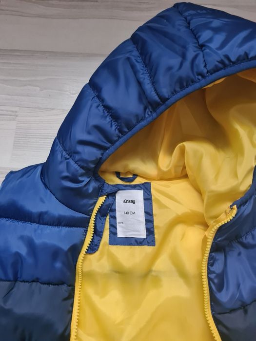 Стеганий жилет з капюшоном