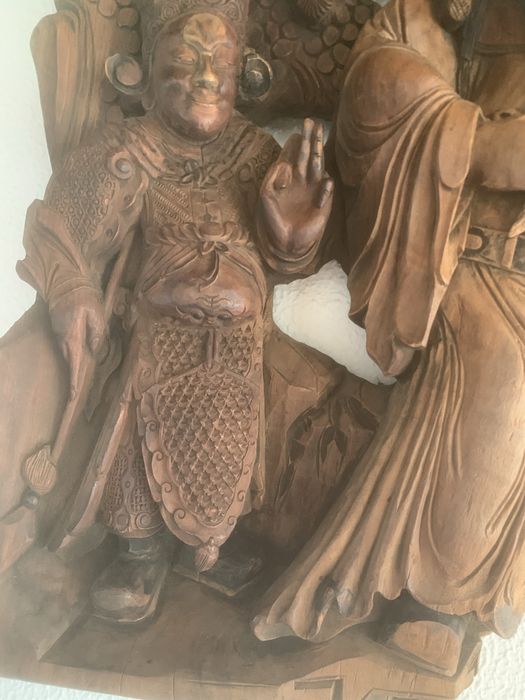 Peça de madeira, talhada com motivos de Macau