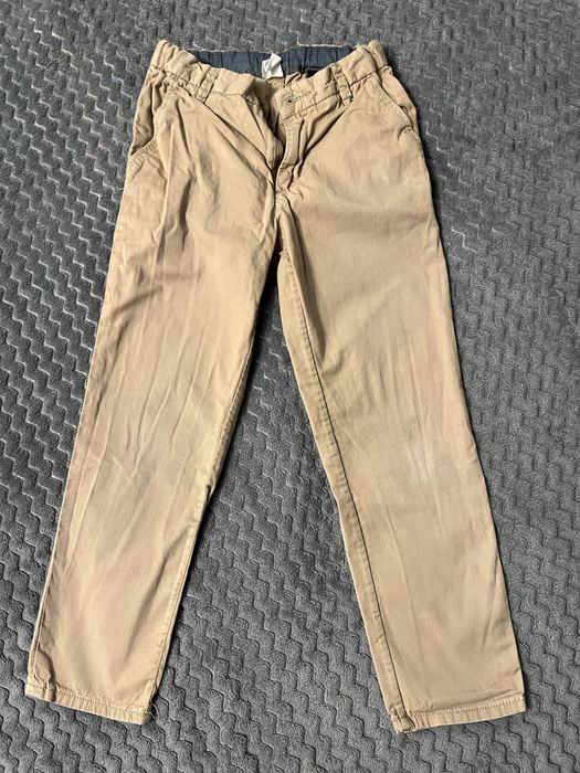 Spodnie eleganckie kremowe HM slim fit beżowe 116 chłopięce