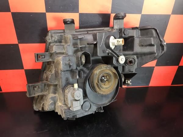 Ótica / farol direita NISSAN NP300 Navara Pick Up (D40)
