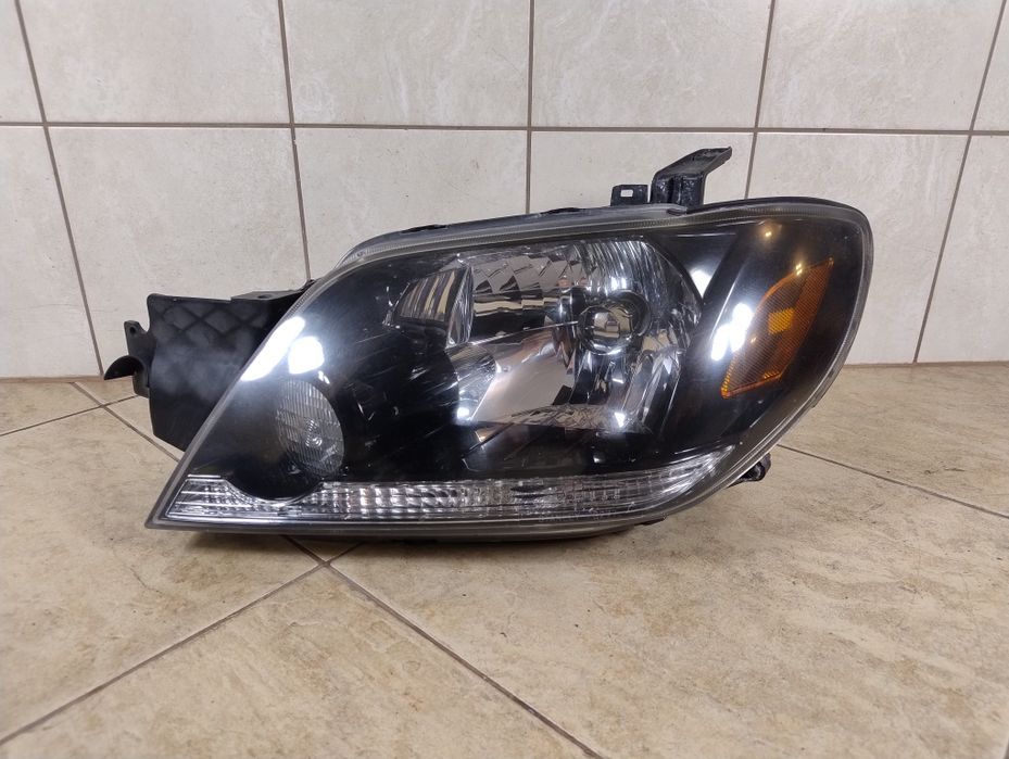 Mitsubishi Outlander I 1 lampa lewa przód Europa reflektor wysyłka