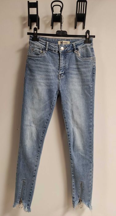 Nowe spodnie jasne jeansy z zamkami