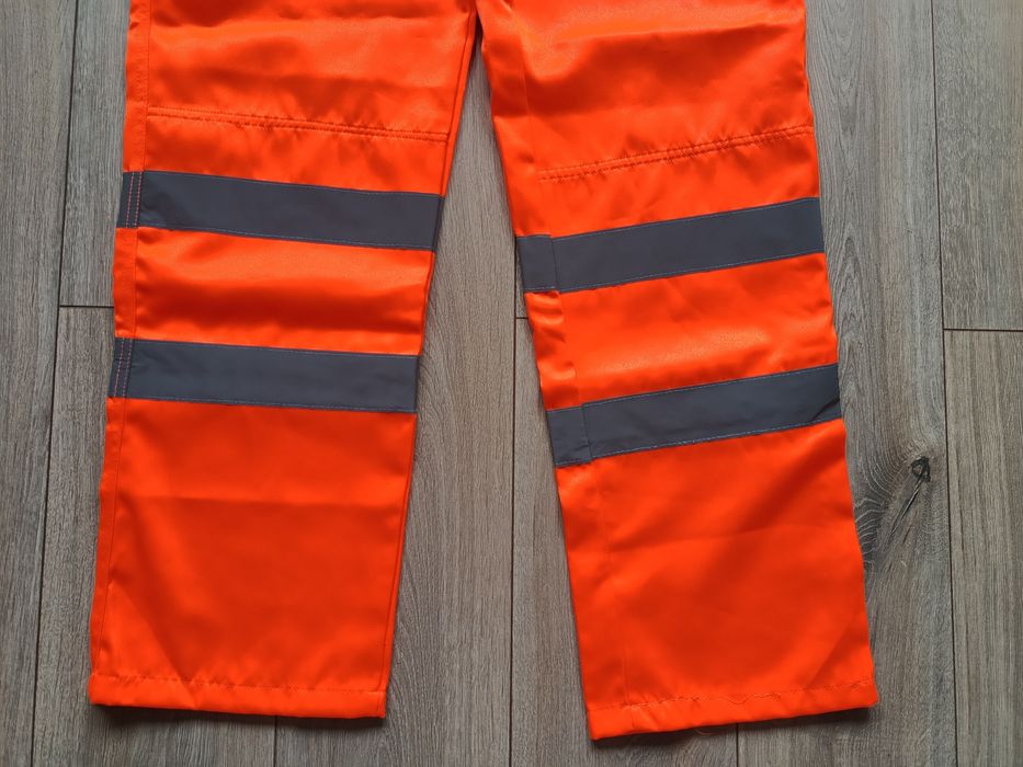 Męskie spodnie robocze pomarańczowe odblaskowe jak nowe Warrior