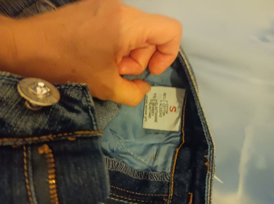 Calças de ganga trabalhadas