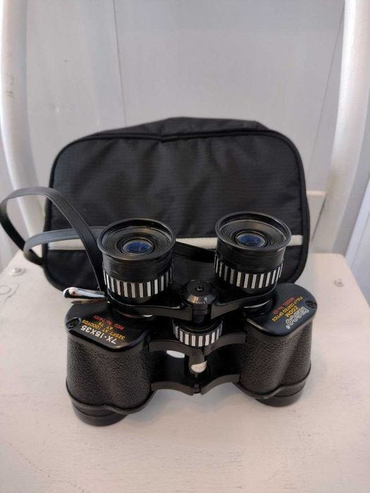 Японский бинокль Tasco 7-15х35 Zoom. Надійна техніка