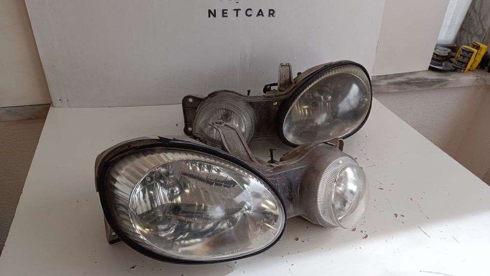 farol óptica Kia shuma 2000