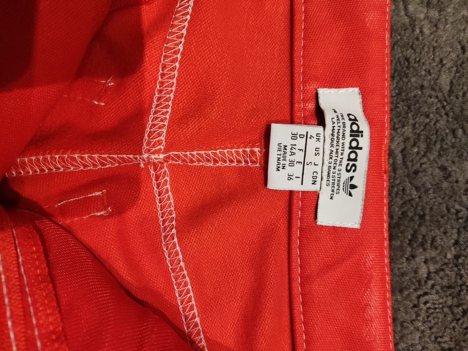 Spodnie adidas fiorucci czerwone.