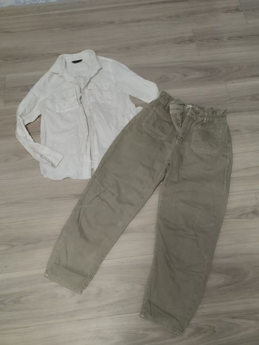 Величезний пакет  одягу на жінку.