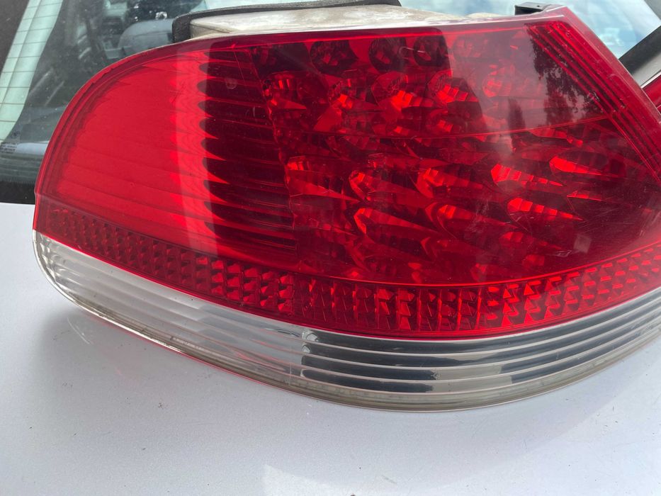 Bmw 7 e65 przed LIFT lampa lewy prawy tył w błotnik biały kierunek