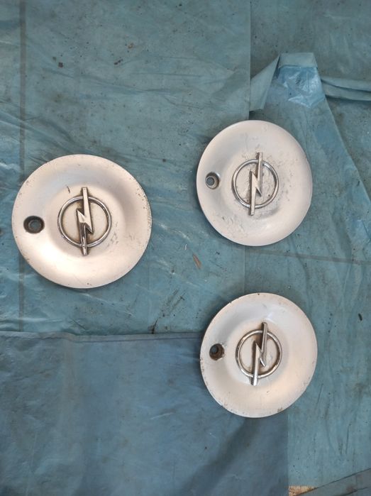 Dekieleki Kapseli Kołpaki do felg aluminiowych OPEL