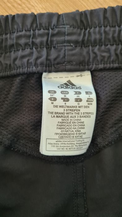 Krótkie spodenki Szorty Adidas. Climalite. Czarne. Żółte paski. Rozmia