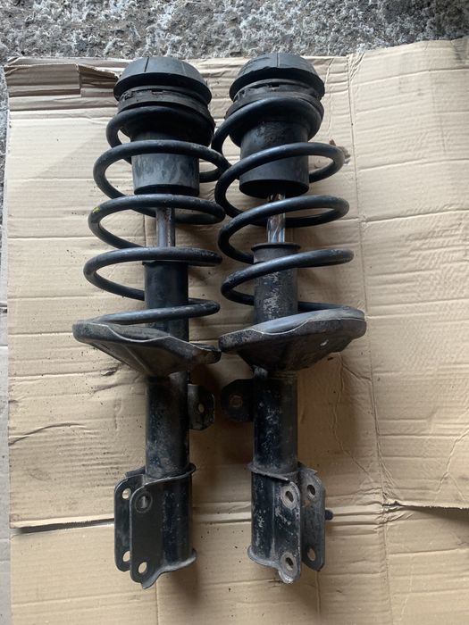 Передние стойки амортизаторы Шевроле Авео заз вида опоры пружины СТО