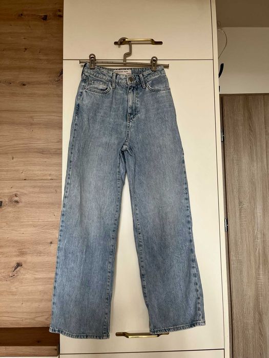 Jasnoniebieskie rozszerzane spodnie jeansy Even&Odd Petite XS 34