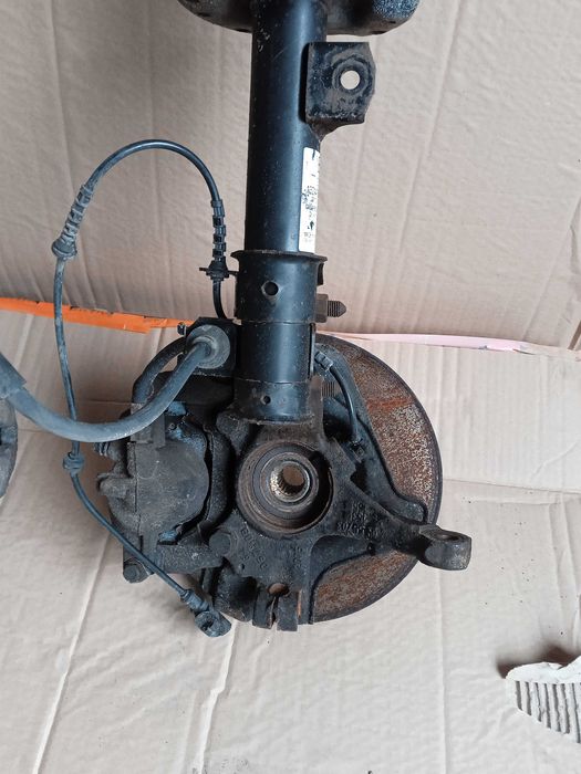 OPEL CORSA E 3D zwrotnica mcperson amortyzator piasta lewa prawa