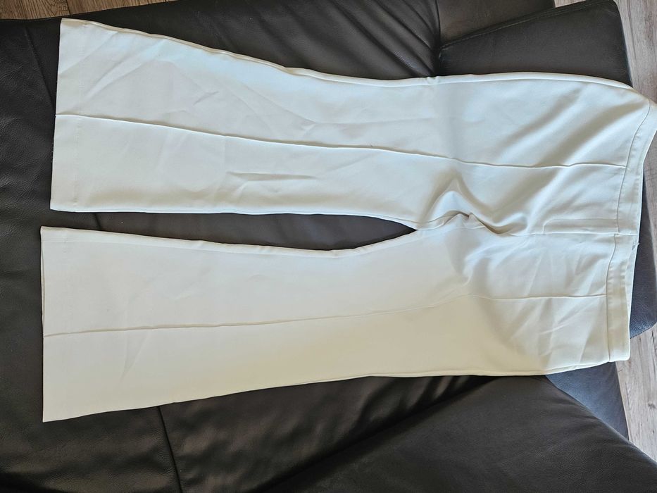 Spodnie biale eleganckie 48