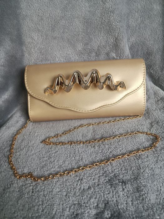Elegancka złota kopertówka