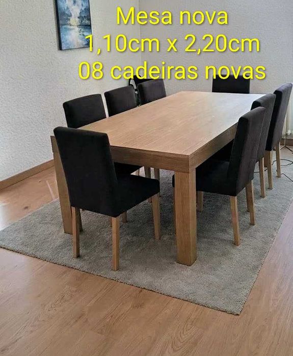 Mesa e 8 cadeiras novas.