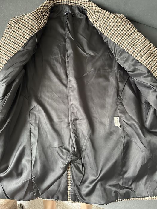 Жіночий піджак в клітинку