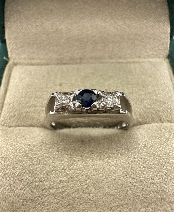 Złoty pierścionek 750 z szafirem 0,15ct i diamentami 0,06ct