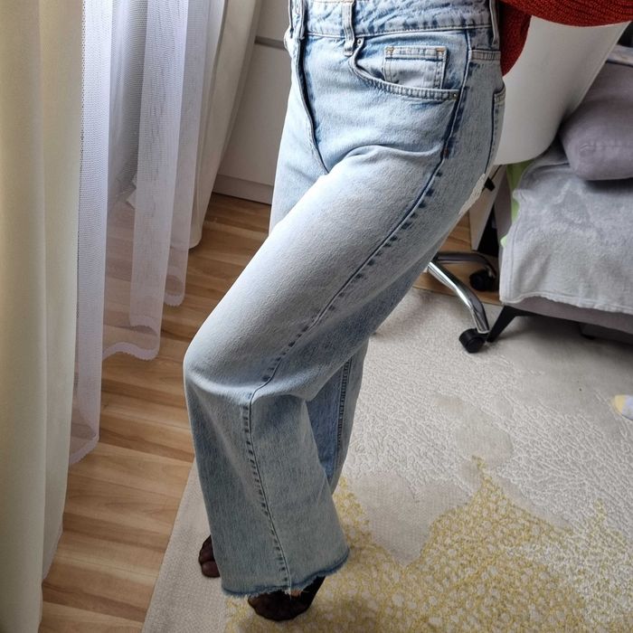 Damskie oryginalne jasnoniebieskie jeansy Cracpot szeroka nogawka S-M