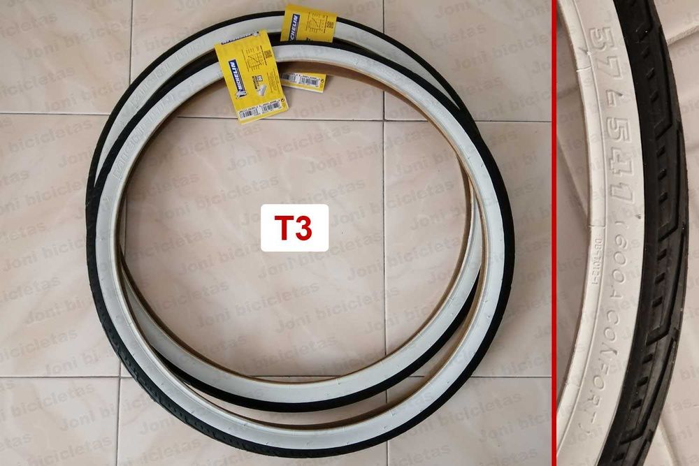 Pneus de bicicleta pretos com faixas brancas