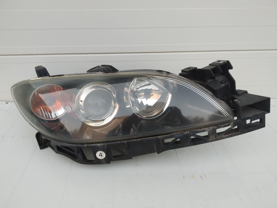 Mazda 3 sedan 03-09 - Reflektor prawy kpl. Oryginał Stanley Europa