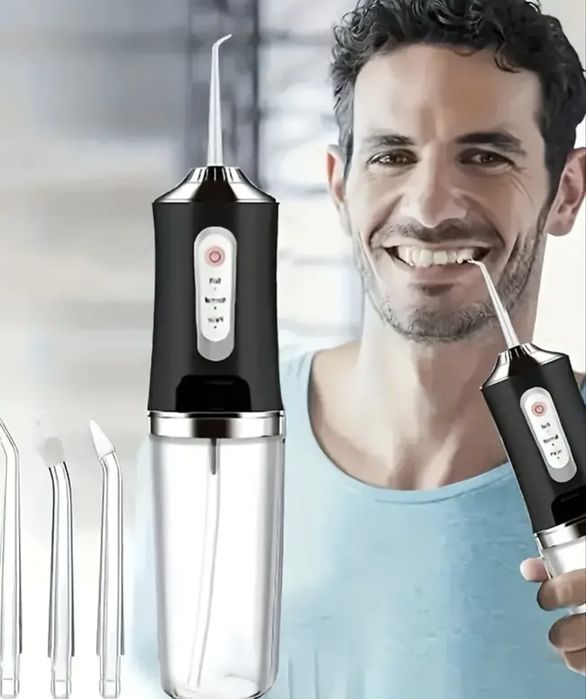 Іригатор доя догляду за зубами та ротовою порожниною з насадками