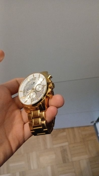 Złoty zegarek firmy TimeMaster (Polska firma)