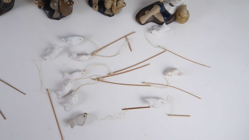 Conjunto de 18 figuras da China em Argila