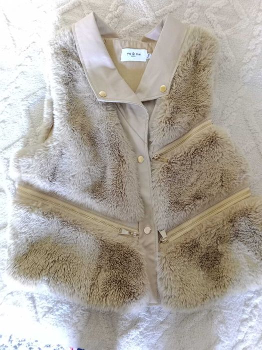 Colete You e Me Paris, muito bem cuidado.