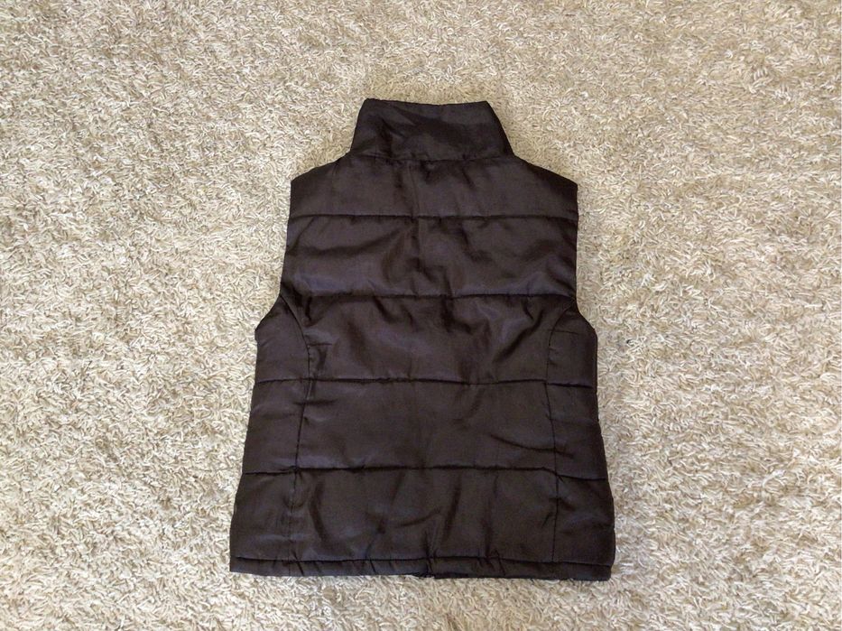 Жилетка теплая.