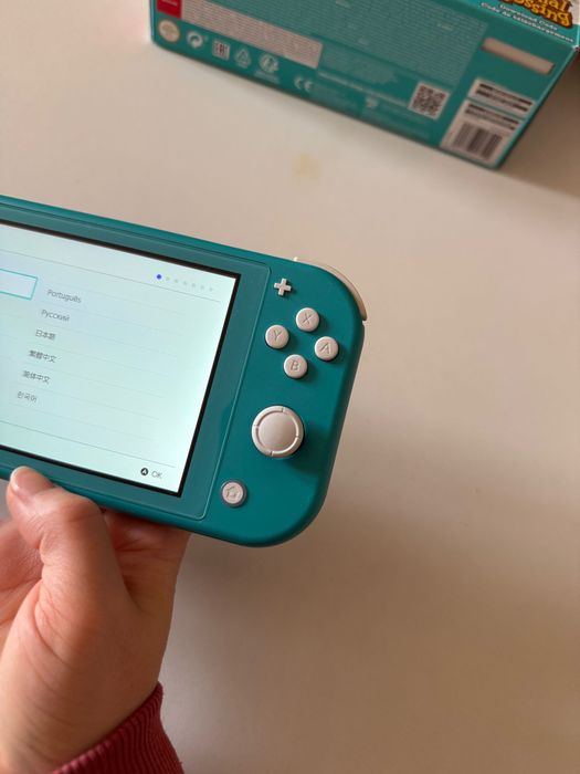 Nintendo Switch Lite c/película de vidro + capas