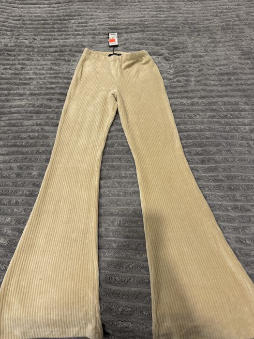 Продам нові кльошні штани в смужку !