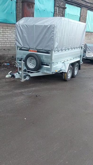 Причіп оцинкований,з двойними бортами, двух осевий, з гальмами.